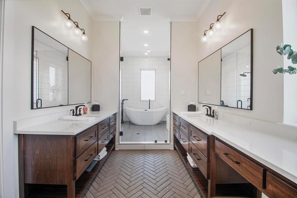22240 Mallards Cove Bullard, TX 75757 - Photo 19 of 40 a spacious bathroom with double vanity and mirrors