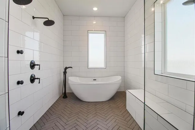 a bedroom with a large bed and a fireplace