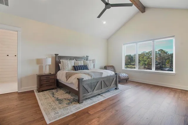 a bathroom with a double vanity sink mirror and bathtub