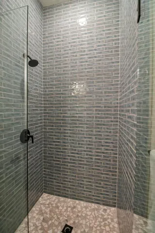 a view of walk in closet with wooden floor and window