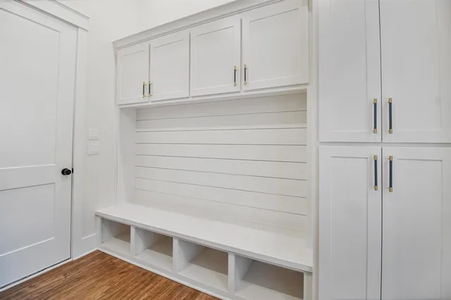 a kitchen with stainless steel appliances a stove a sink and a microwave