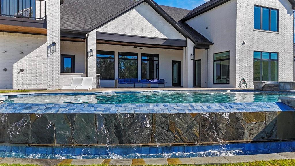 22240 Mallards Cove Bullard, TX 75757 - Photo 5 of 40 a front view of a house with a yard