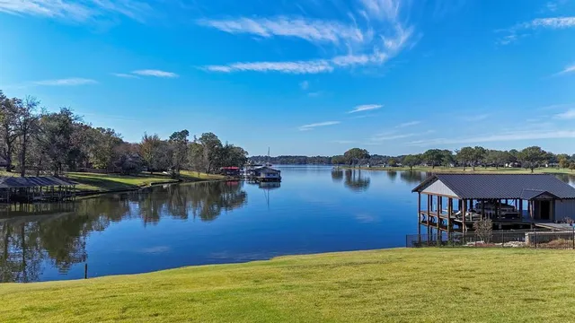 a view of a lake with houses in the background