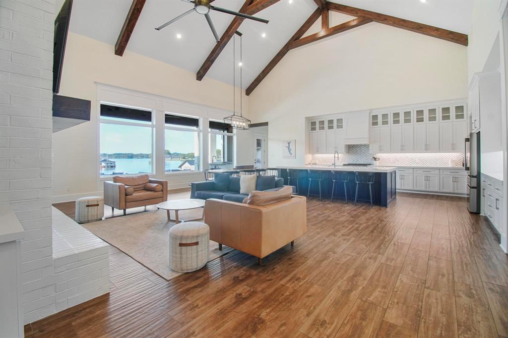 22240 Mallards Cove Bullard, TX 75757 - Photo 9 of 40 a living room with furniture and a wooden floor
