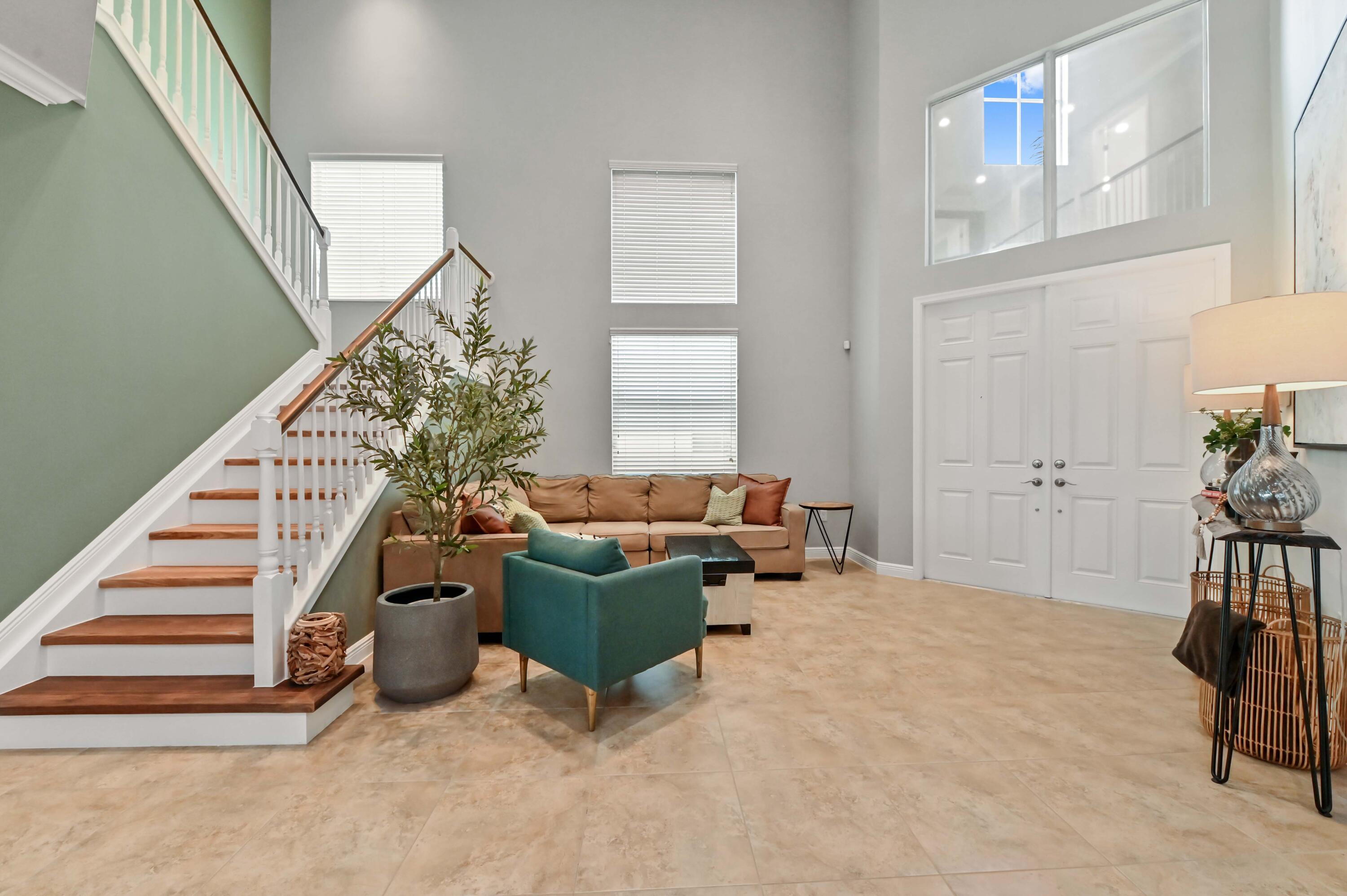 2910 Payson Way Wellington, FL 33414 - Photo 11 of 51 a living room with furniture and a stair