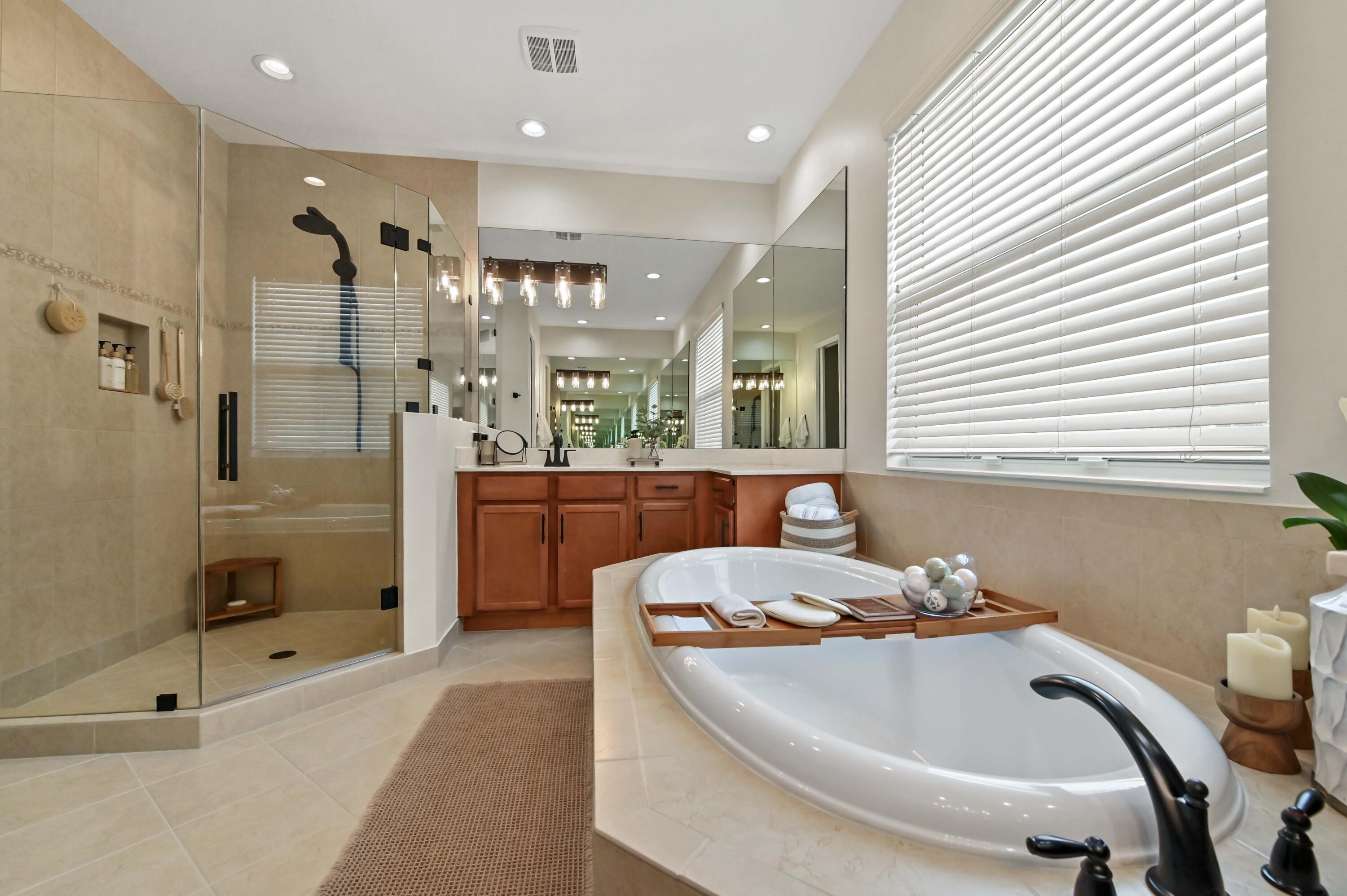 2910 Payson Way Wellington, FL 33414 - Photo 23 of 51 a bathroom with a tub sink shower and mirror