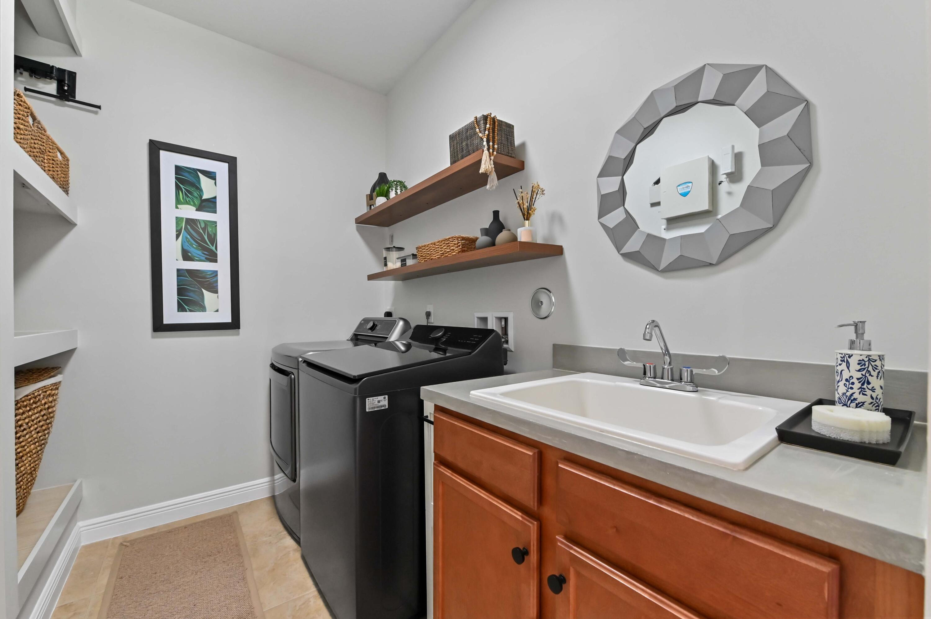 2910 Payson Way Wellington, FL 33414 - Photo 28 of 51 a kitchen with stainless steel appliances granite countertop a sink and a stove