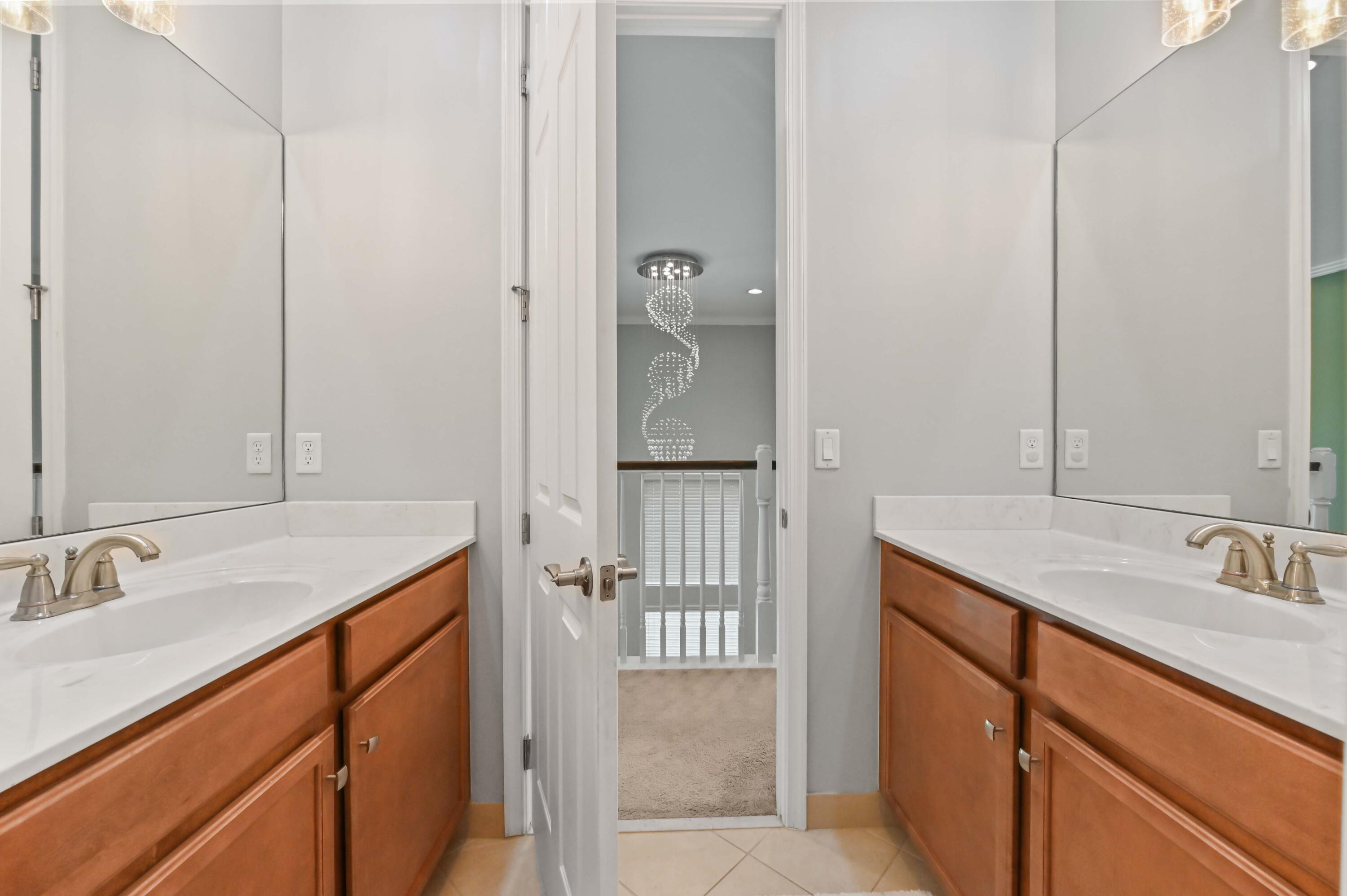 2910 Payson Way Wellington, FL 33414 - Photo 30 of 51 a bathroom with a sink and a mirror