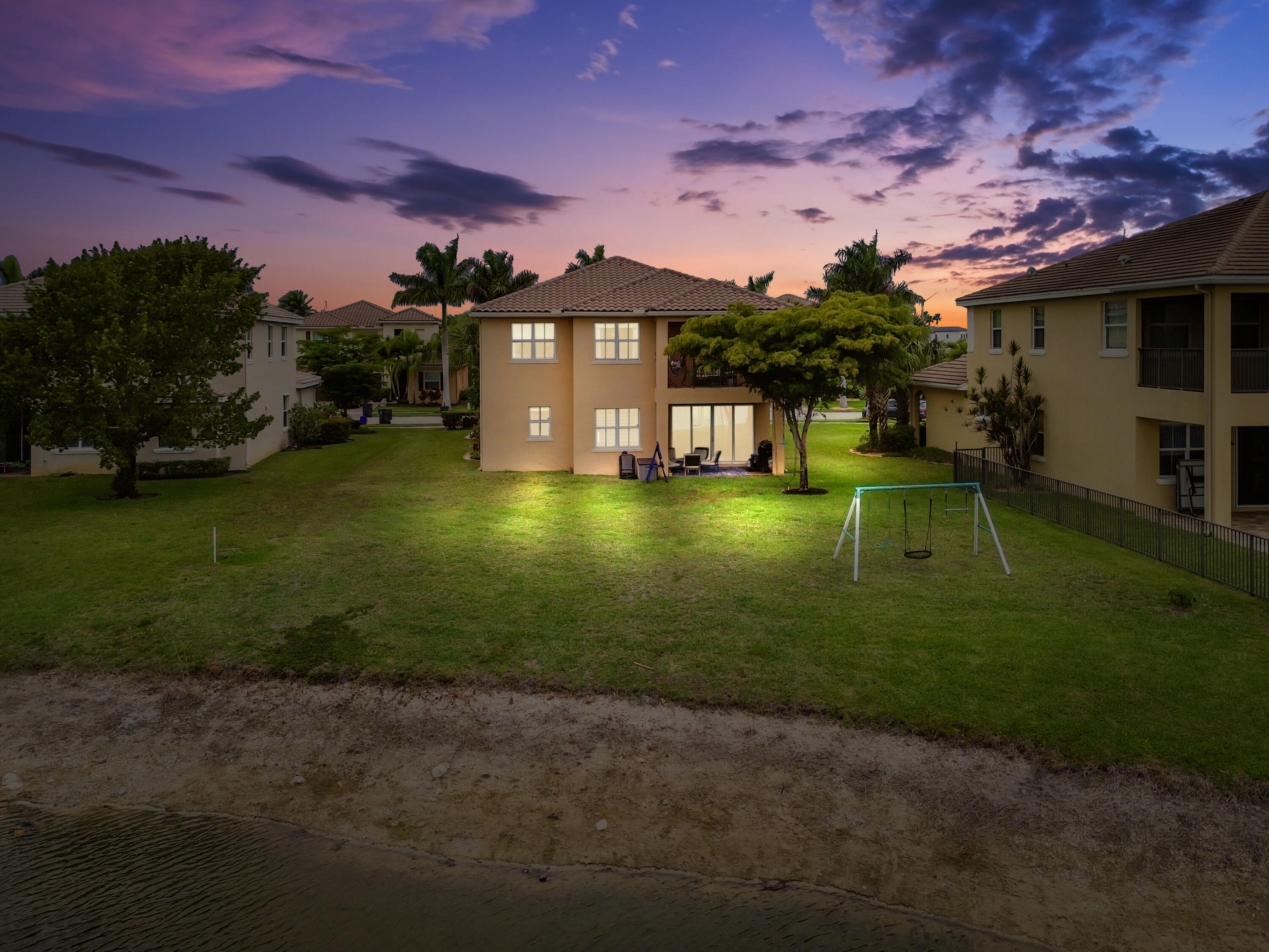 2910 Payson Way Wellington, FL 33414 - Photo 45 of 51 a view of a big house with a big yard