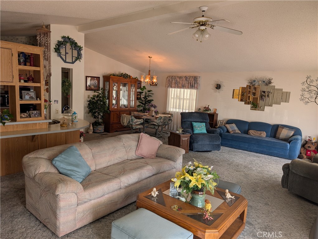 2500 Highway 59, Unit 103 Merced, CA 95348 - Photo 5 of 14 a living room with furniture ceiling fan and a window