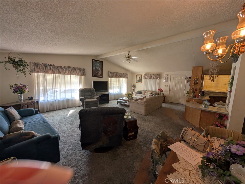 2500 Highway 59, Unit 103 Merced, CA 95348 - Photo 7 of 14 a living room with furniture window and kitchen view
