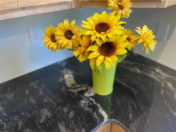 a vase of flowers sitting on a table
