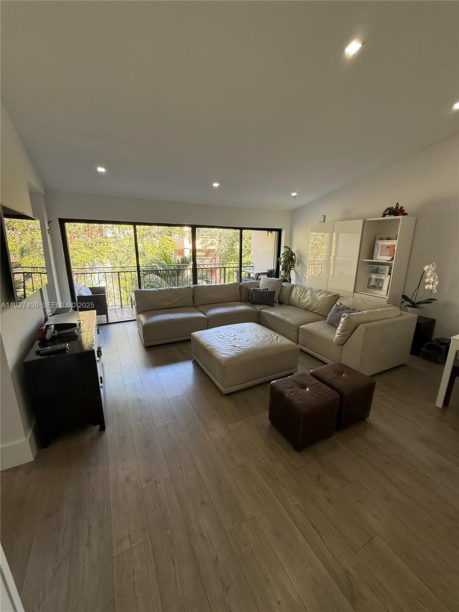 9001 Southwest 94th Street, Unit 208 Miami, FL 33176 - Photo 1 of 27 a living room with furniture and a large window