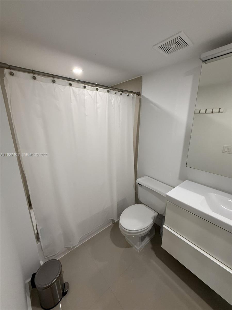 9001 Southwest 94th Street, Unit 208 Miami, FL 33176 - Photo 16 of 27 a bathroom with a sink and a toilet