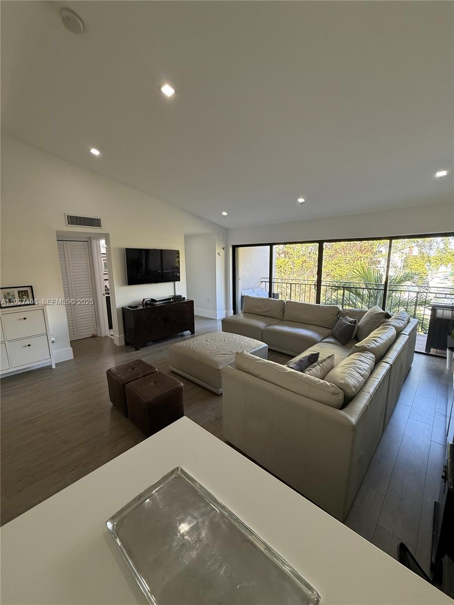 9001 Southwest 94th Street, Unit 208 Miami, FL 33176 - Photo 3 of 27 a living room with furniture and a large window