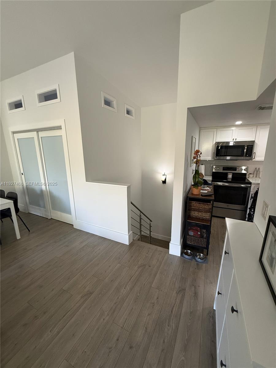 9001 Southwest 94th Street, Unit 208 Miami, FL 33176 - Photo 4 of 27 a view of kitchen and wooden floor