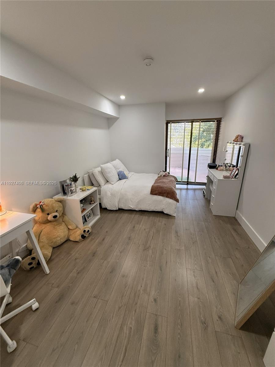 9001 Southwest 94th Street, Unit 208 Miami, FL 33176 - Photo 10 of 27 a living room with furniture and a wooden floor