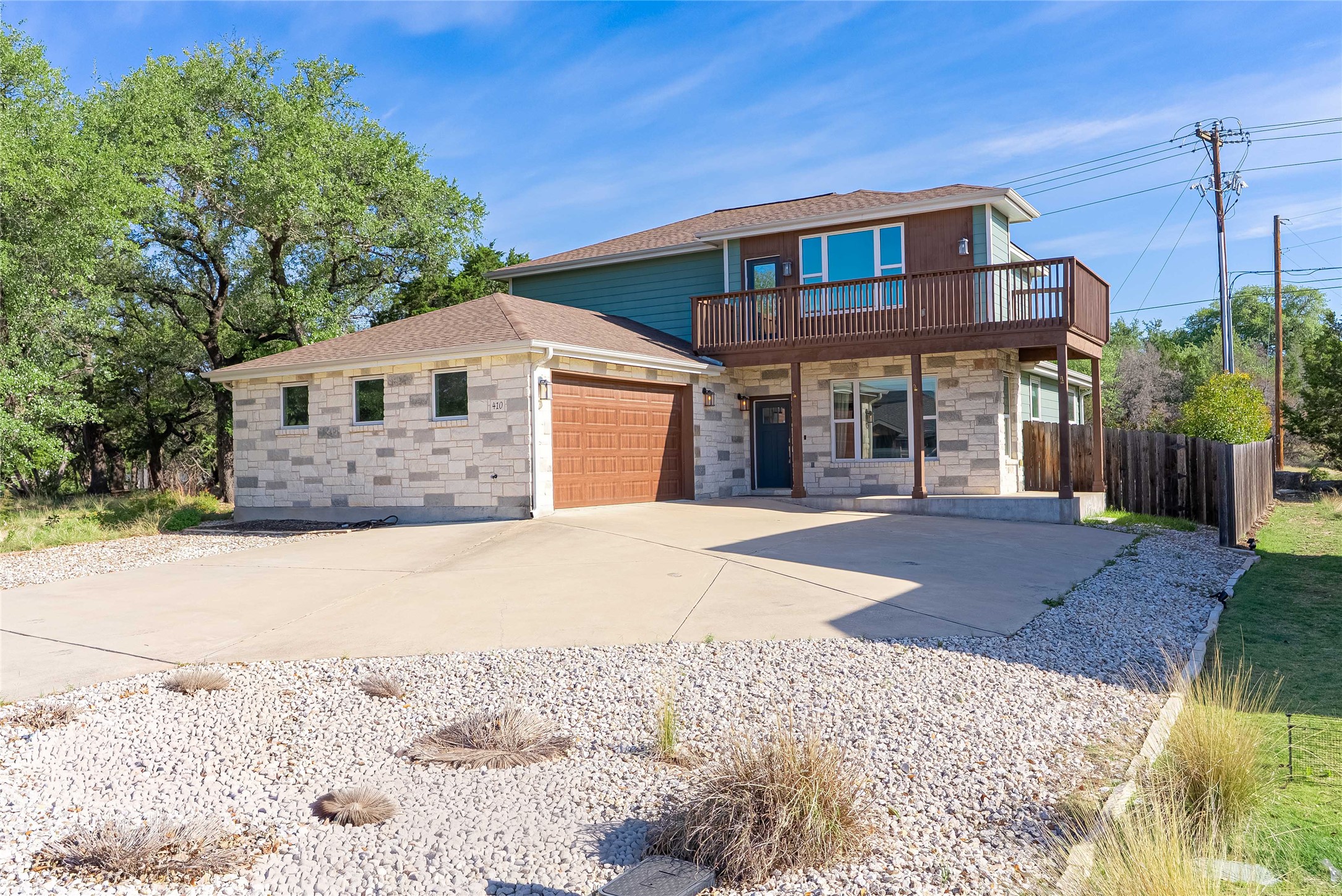 410 Summit Ridge Drive North Point Venture, TX 78645 - Photo 1 of 37 a front view of a house with a yard