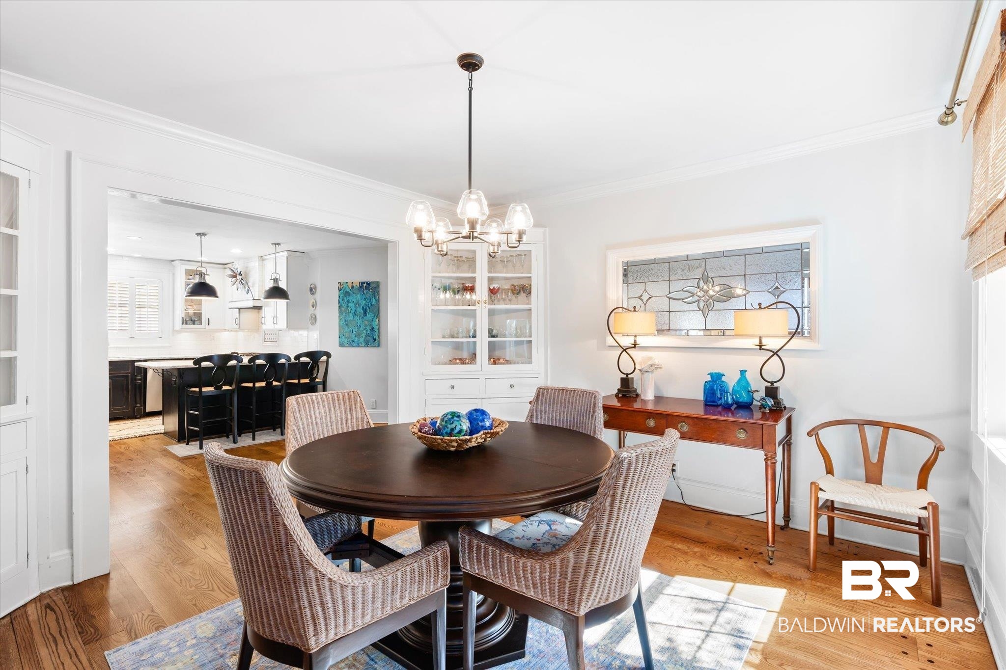 202 Woodlands Avenue Mobile, AL 36607 - Photo 9 of 53 Dining space with ornamental molding, light hardwood / wood-style flooring, and a notable chandelier