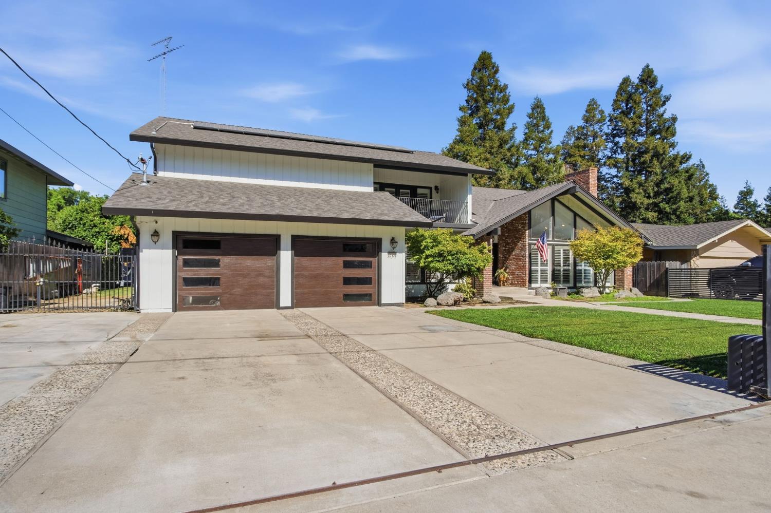 10401 Golf Link Road Turlock, CA 95380 - Photo 2 of 63 front view of a house with a yard