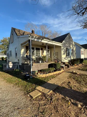 a view of a house with snow on the wall