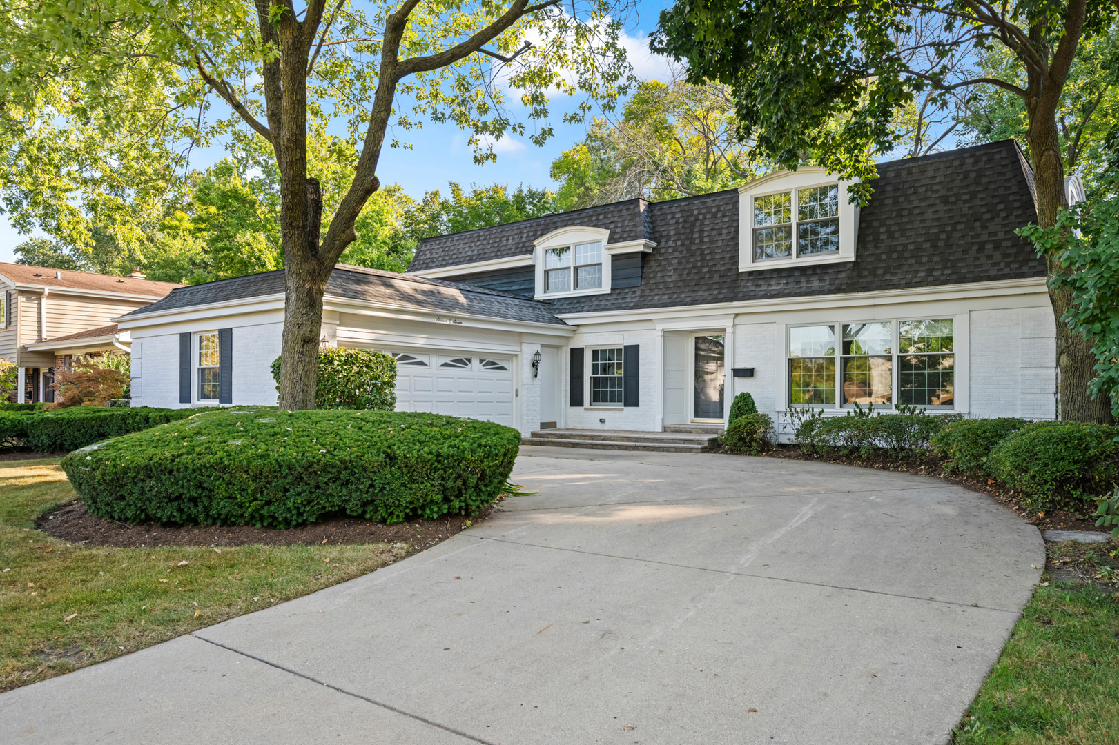 front view of a house with a garden