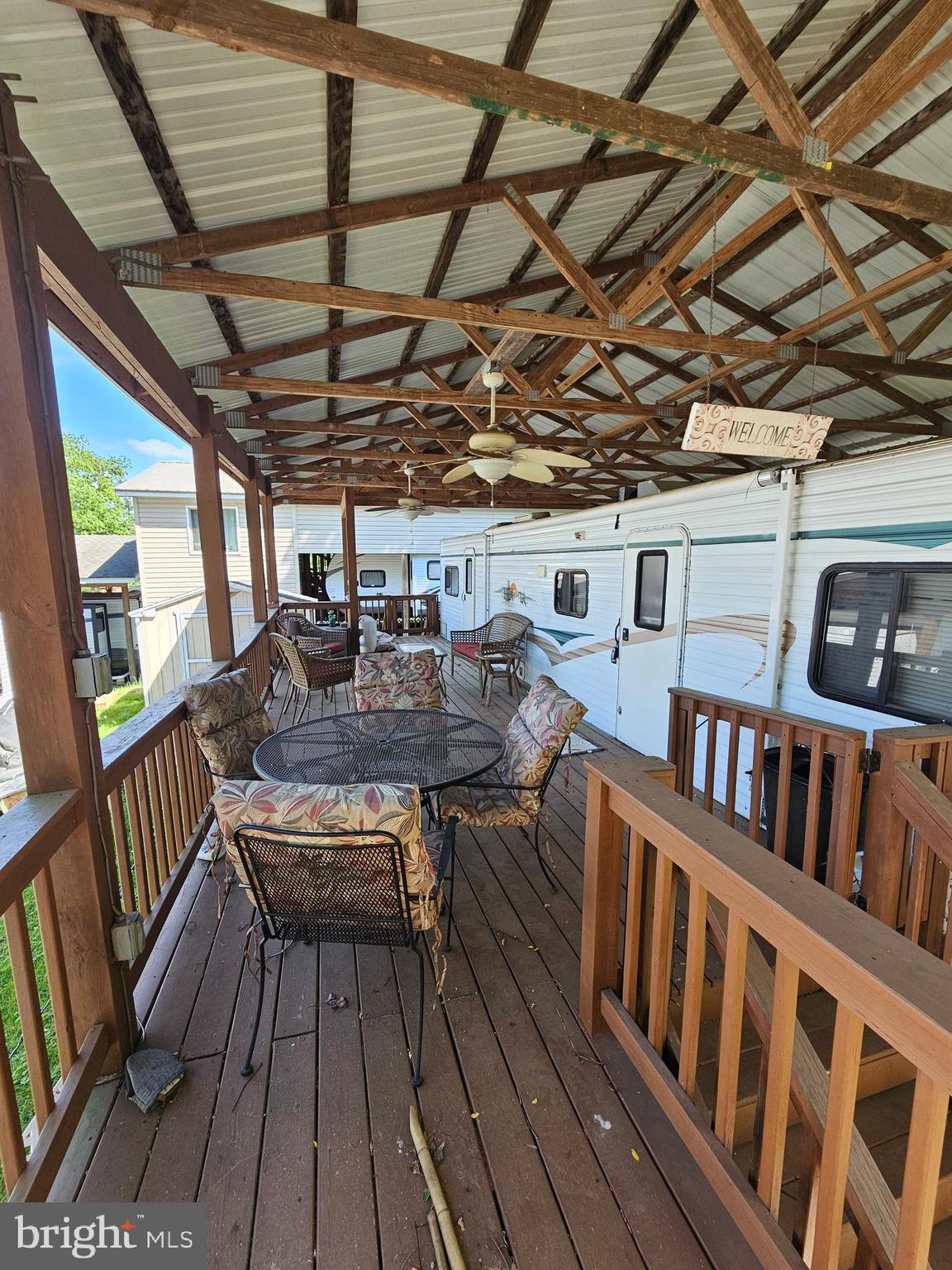 17 Hot Springs Road Falling Waters, WV 25419 - Photo 5 of 15 a roof deck with table and chairs and wooden floor