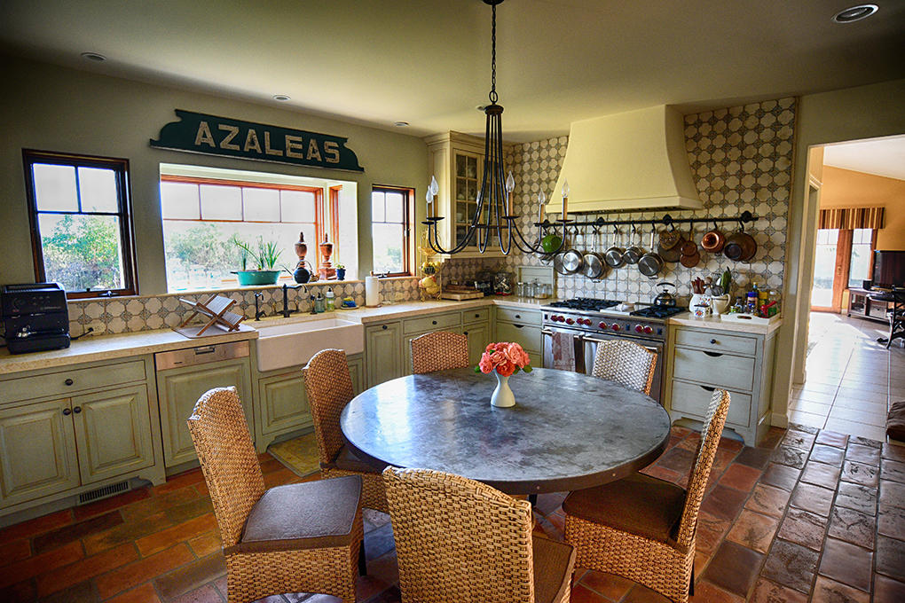 1945 Meiners Road Ojai, CA 93023 - Photo 17 of 21 a kitchen with a table chairs sink and cabinets
