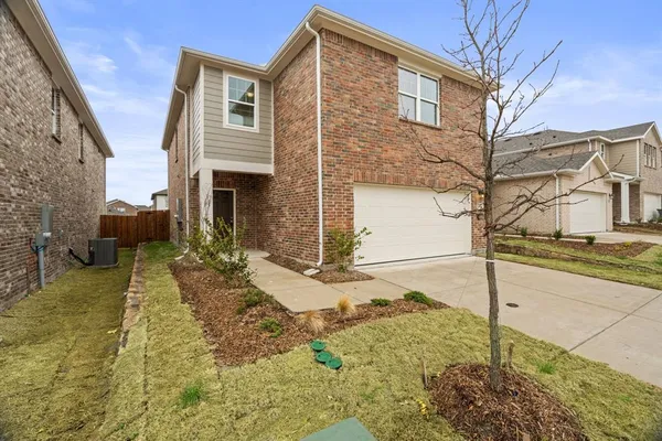 a front view of a house with garage
