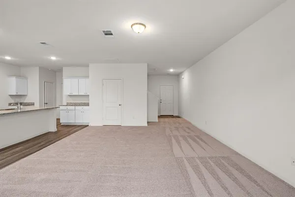 a large kitchen with cabinets