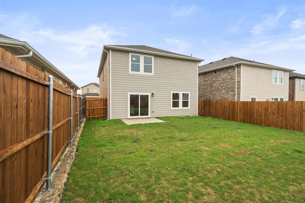 619 Colgate Circle Princeton, TX 75407 - Photo 6 of 31 a view of a house with backyard and garden