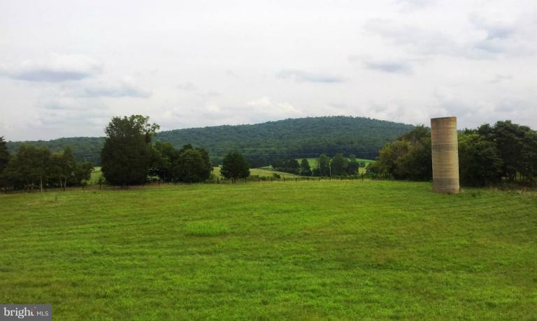 7516 Dudie Road Marshall, VA 20115 - Photo 2 of 11 a view of a field of grass and trees