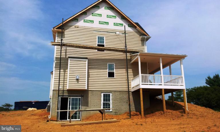 7516 Dudie Road Marshall, VA 20115 - Photo 9 of 11 a front view of a house with a balcony