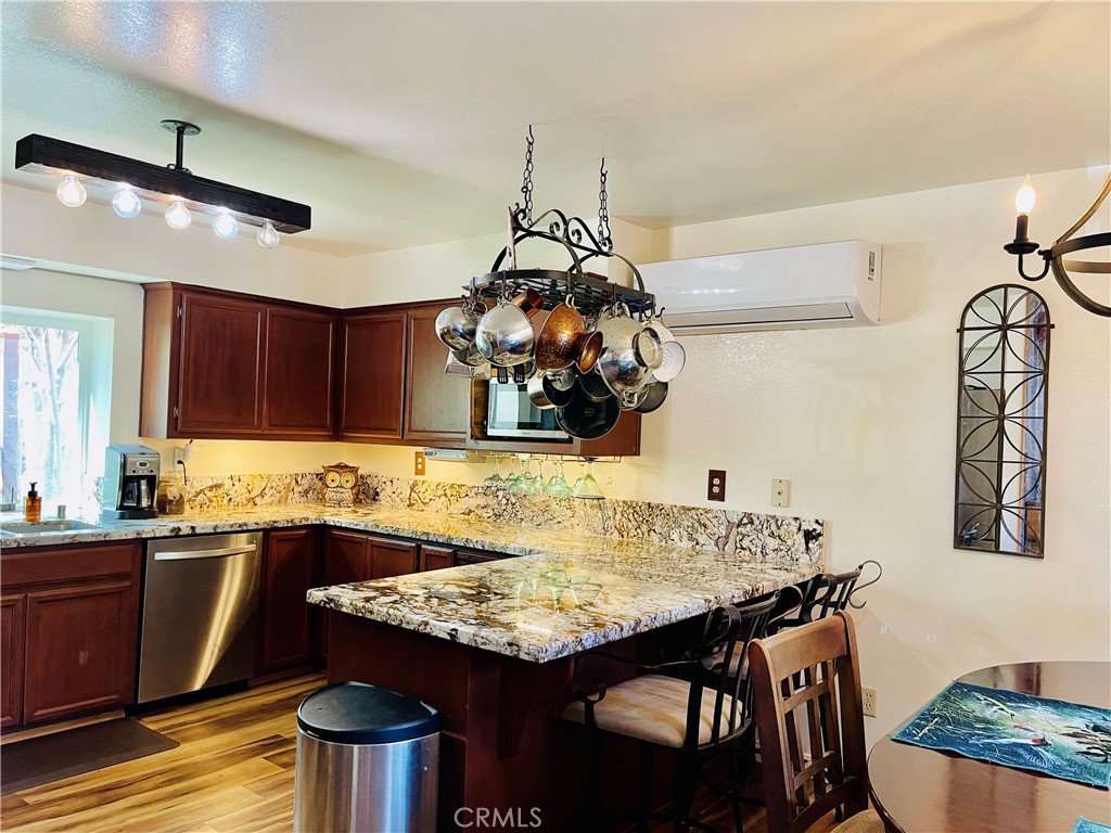 921 Piru Way Frazier Park, CA 93225 - Photo 14 of 54 a kitchen with a table and chairs in it