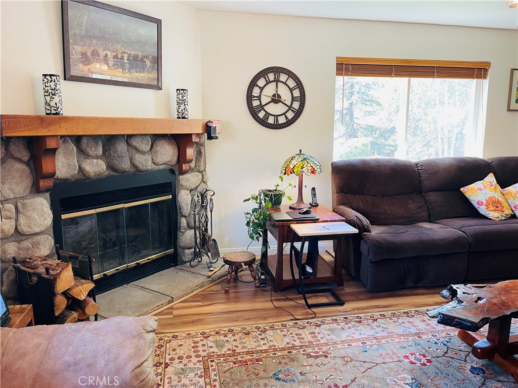 921 Piru Way Frazier Park, CA 93225 - Photo 2 of 54 a living room with furniture a window and a fireplace