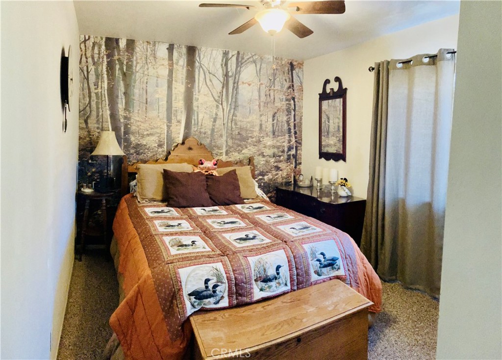 921 Piru Way Frazier Park, CA 93225 - Photo 39 of 54 a bed sitting in a bedroom next to a window