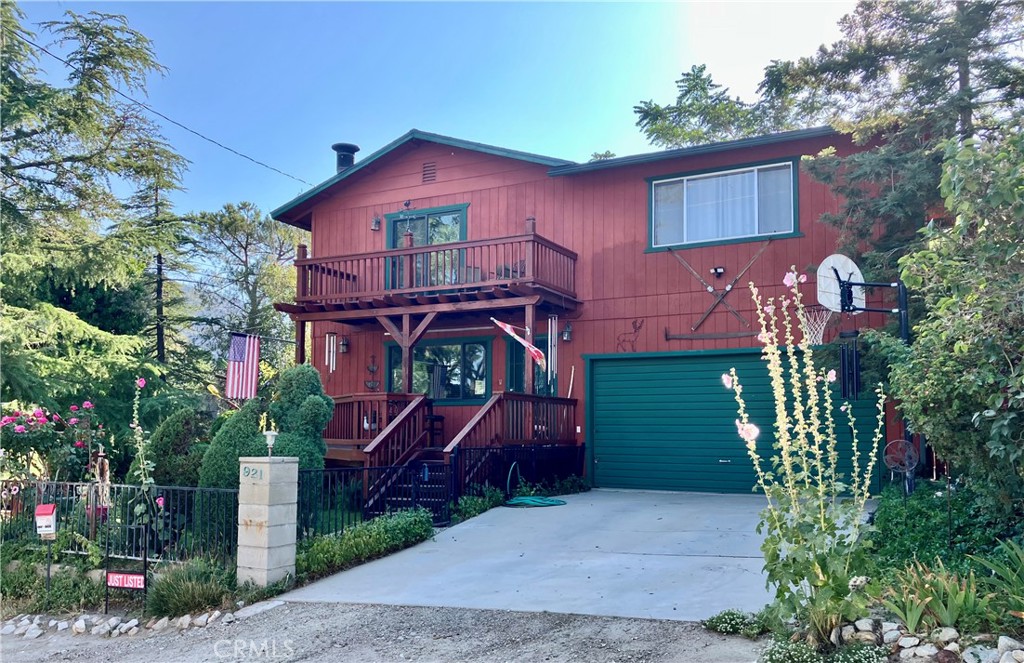 921 Piru Way Frazier Park, CA 93225 - Photo 6 of 54 a front view of a house with a yard