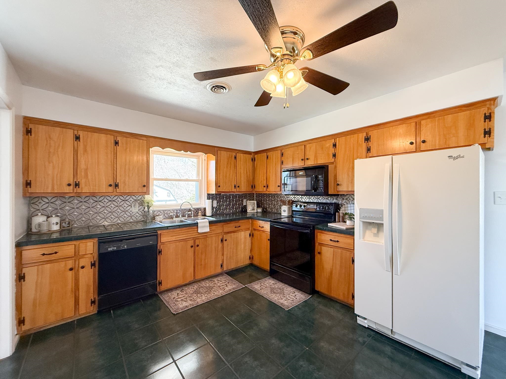 1606 Ridgeway Drive Staunton, VA 24401 - Photo 14 of 27 a kitchen with stainless steel appliances granite countertop cabinets and a refrigerator