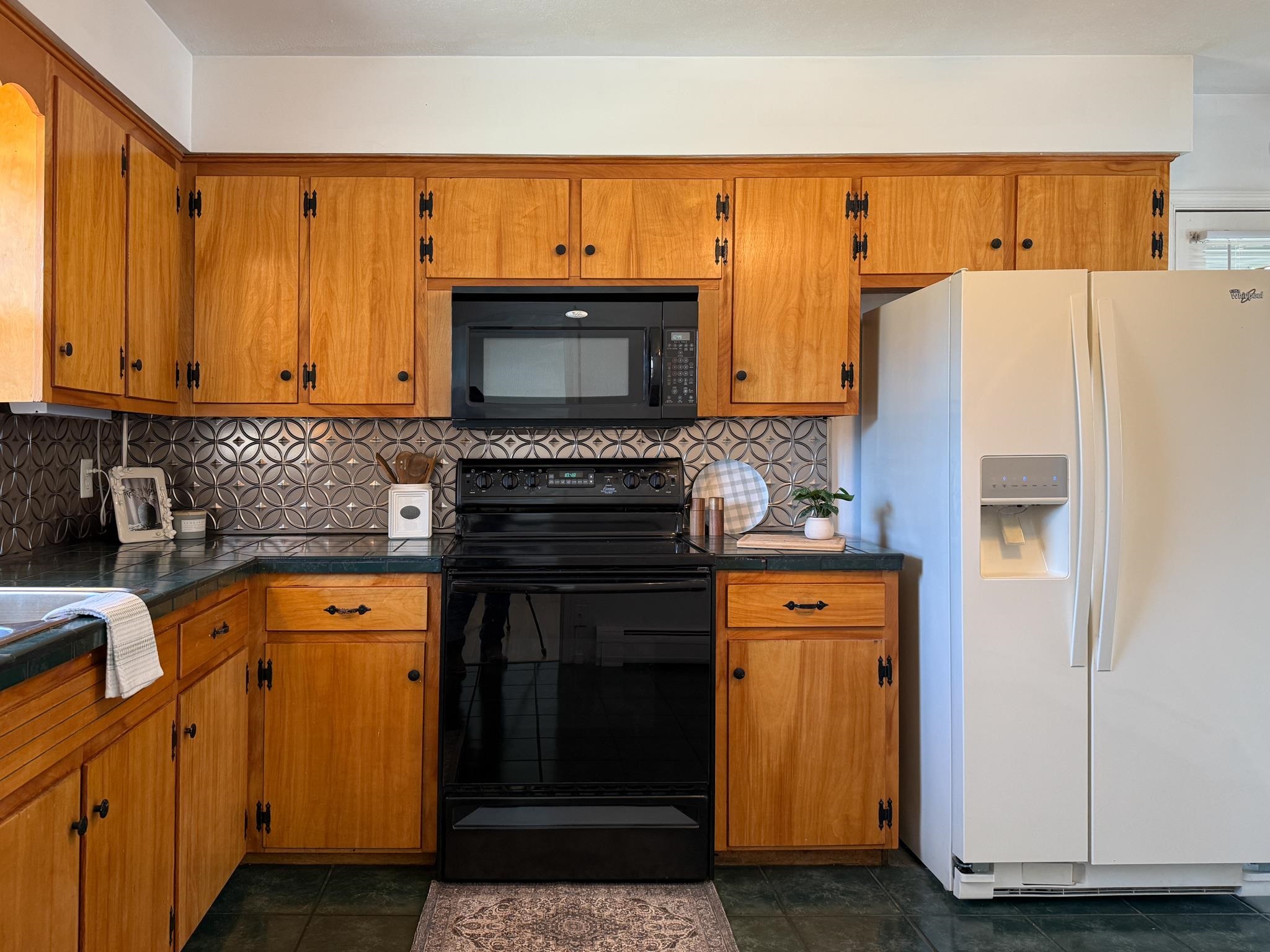 1606 Ridgeway Drive Staunton, VA 24401 - Photo 16 of 27 a kitchen with stainless steel appliances a stove a microwave and a refrigerator