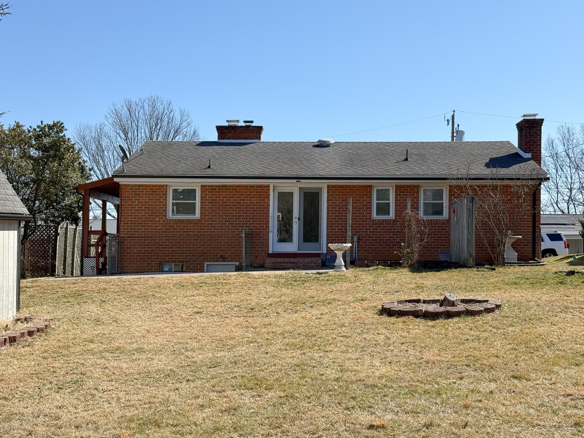 1606 Ridgeway Drive Staunton, VA 24401 - Photo 7 of 27 a house with trees in the background