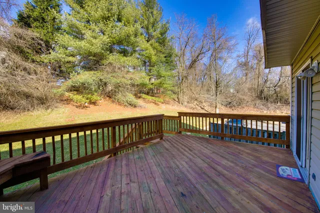 a view of balcony with wooden floor