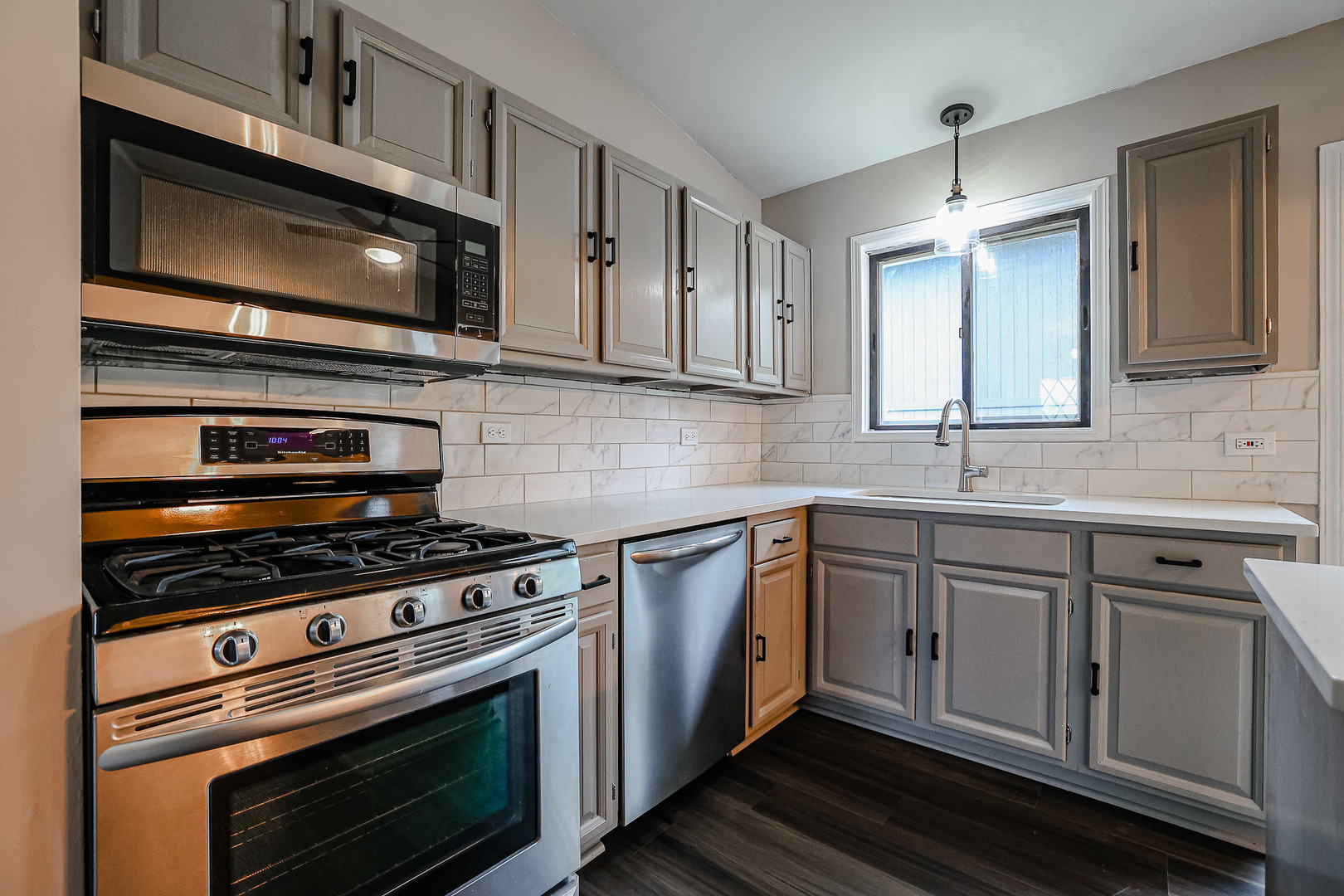 200 Hickory Drive Lindenhurst, IL 60046 - Photo 11 of 34 a kitchen with cabinets stainless steel appliances and a sink