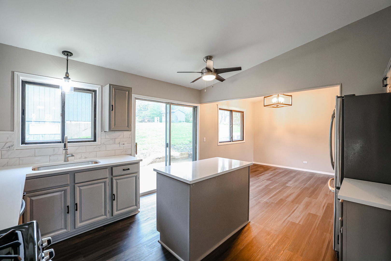 200 Hickory Drive Lindenhurst, IL 60046 - Photo 12 of 34 a living room with stainless steel appliances granite countertop furniture and a sink