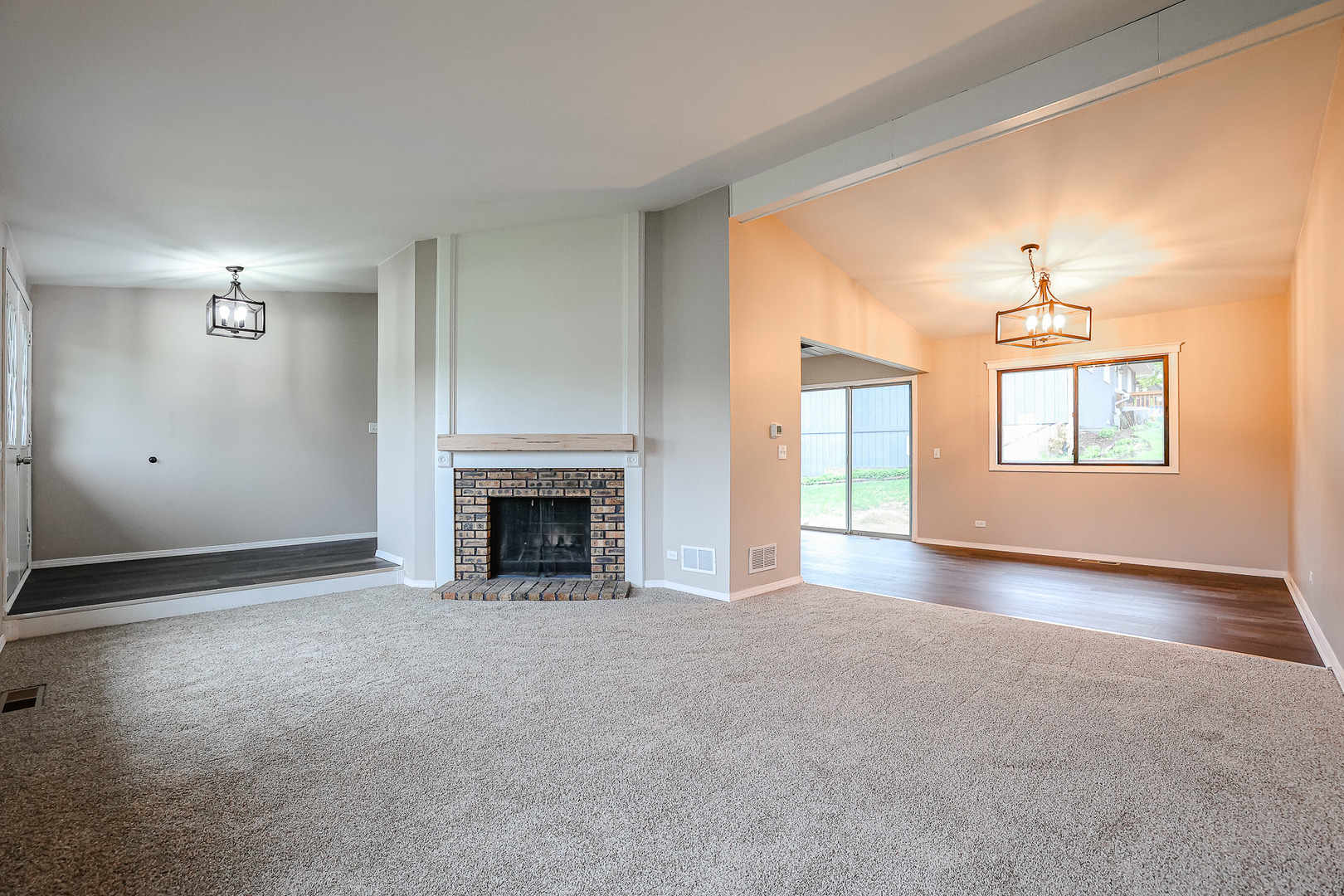 200 Hickory Drive Lindenhurst, IL 60046 - Photo 5 of 34 a view of a livingroom with a fireplace