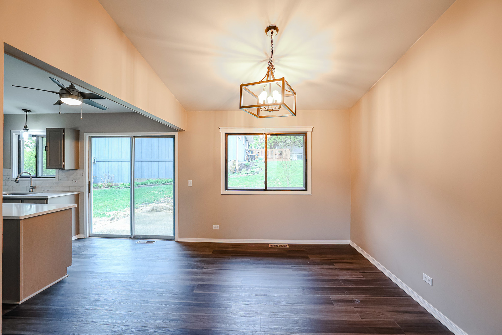 200 Hickory Drive Lindenhurst, IL 60046 - Photo 7 of 34 a view of a room with wooden floor chandeliers and kitchen