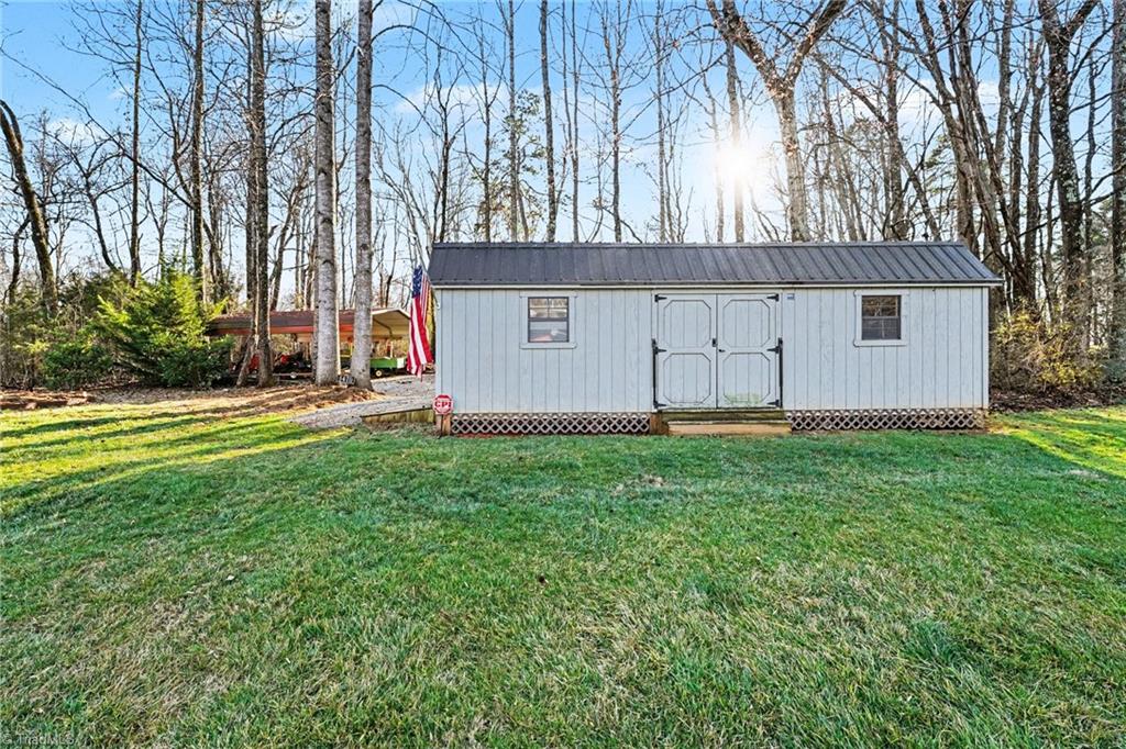 1470 Robert Beck Road Lexington, NC 27292 - Photo 39 of 50 Outbuilding measures 28x11...detached carport 18x20 for more