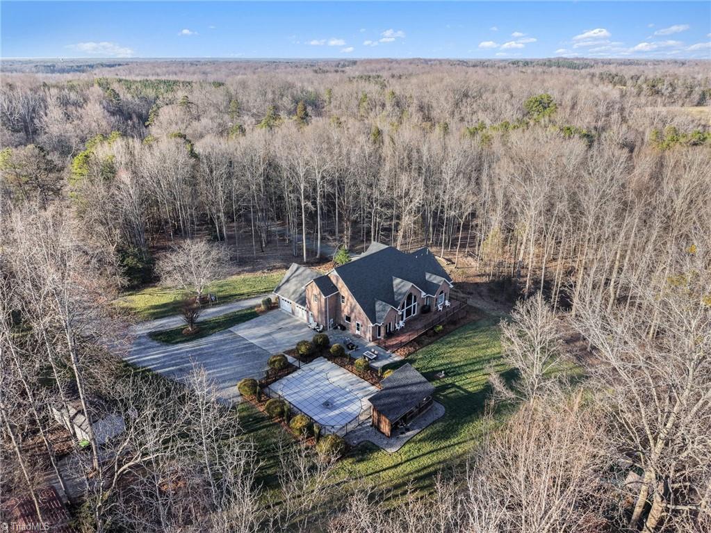 1470 Robert Beck Road Lexington, NC 27292 - Photo 48 of 50 Surrounding trees provide privacy and highlight the nicely landscaped grounds and manicured lawn.