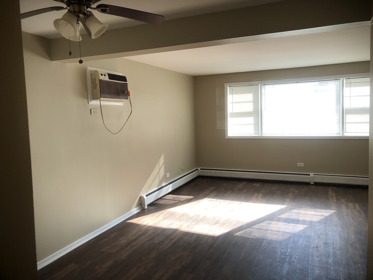 6742 West 63rd Street, Unit 1 Chicago, IL 60638 - Photo 13 of 21 a view of a room with window and a ceiling fan