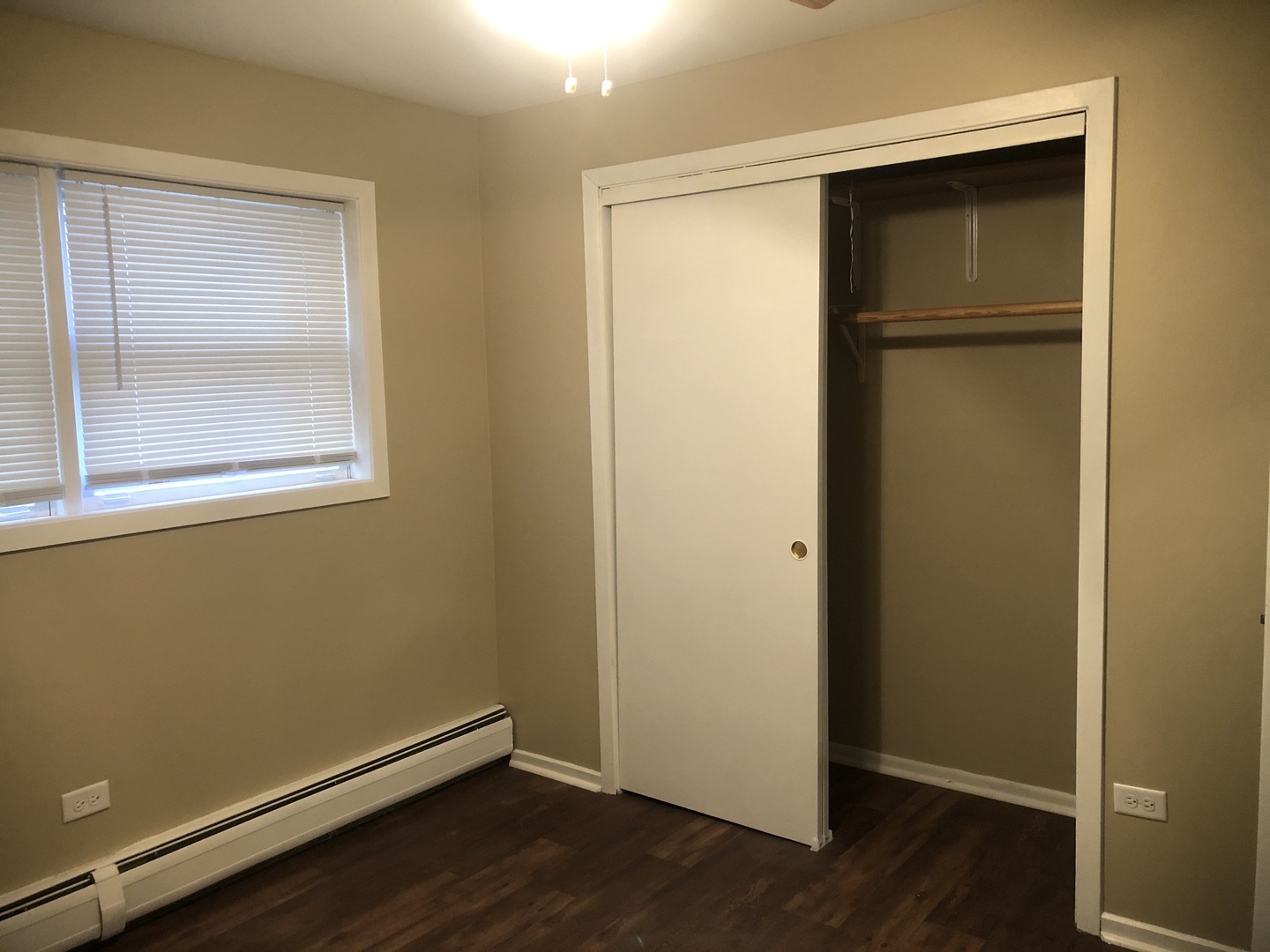 6742 West 63rd Street, Unit 1 Chicago, IL 60638 - Photo 10 of 21 a view of an empty room with wooden floor and a window