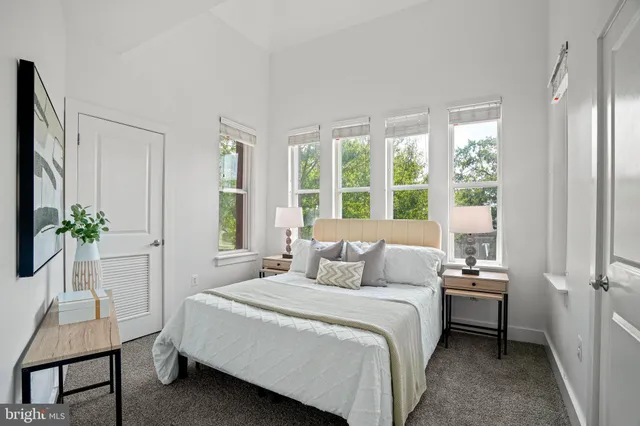 a bedroom with a bed and a chair